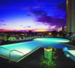 The pool of the Hawaii Prince Hotel Waikiki sits on a fifth floor roof, overlooking a marina. 